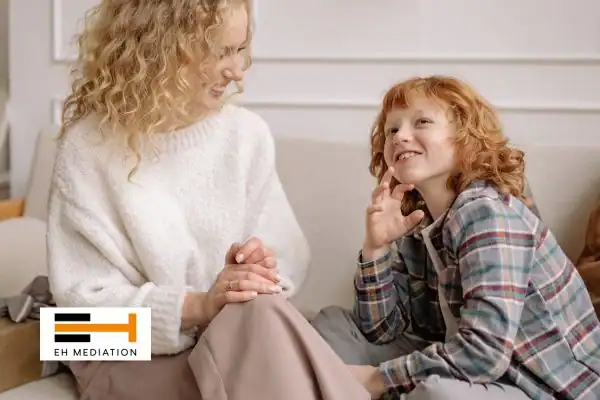 Happy mother and child after sorting child arrangements mediation Hook